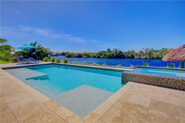 view of pool featuring a water view, an in ground hot tub, and a patio area