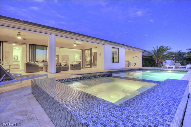 view of pool with an in ground hot tub, a patio area, and outdoor lounge area