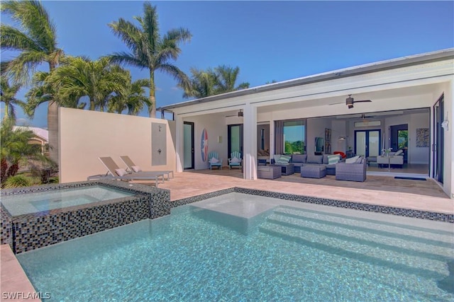 view of pool with ceiling fan, an in ground hot tub, a patio area, and outdoor lounge area