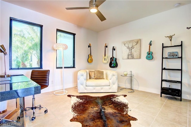 living area featuring ceiling fan and light tile patterned flooring