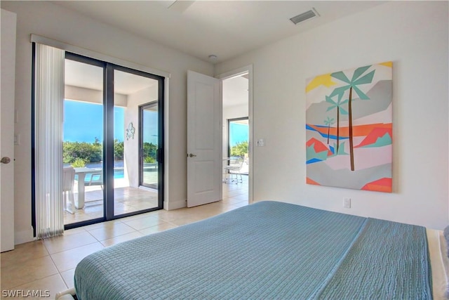 bedroom with access to outside and light tile patterned floors