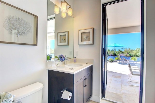 bathroom with toilet and vanity