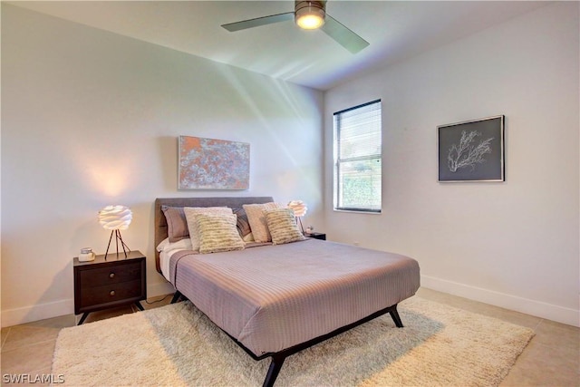 tiled bedroom with ceiling fan