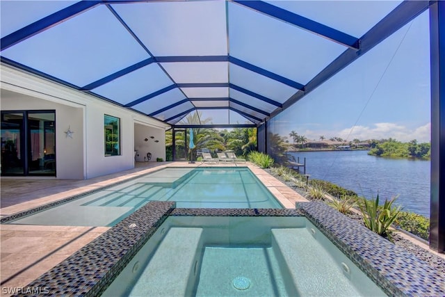 view of swimming pool with a lanai, a patio area, and a water view