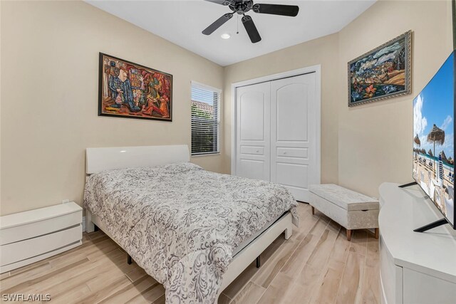 bedroom featuring a closet, ceiling fan, and light hardwood / wood-style flooring