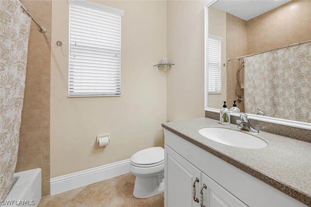 full bathroom featuring tile floors, toilet, vanity, and shower / tub combo with curtain