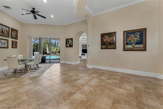 interior space featuring ceiling fan, ornamental molding, and light tile floors