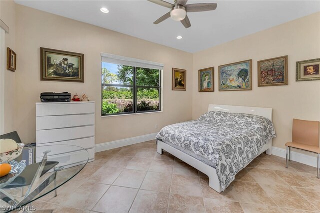 tiled bedroom featuring ceiling fan