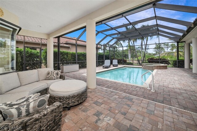 view of pool with a lanai and a patio