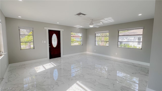 foyer with light tile flooring and ceiling fan