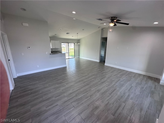 spare room featuring ceiling fan, hardwood / wood-style flooring, and lofted ceiling