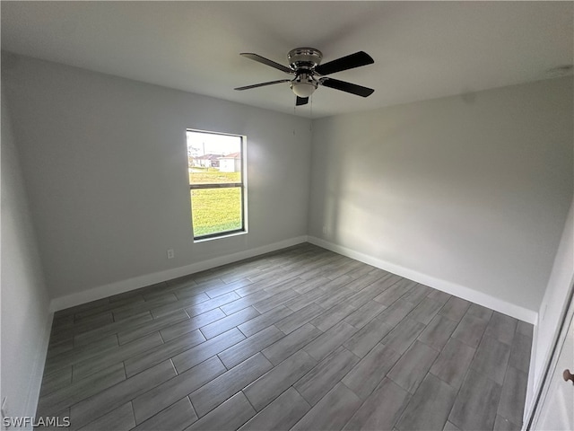 unfurnished room featuring ceiling fan and light wood-type flooring