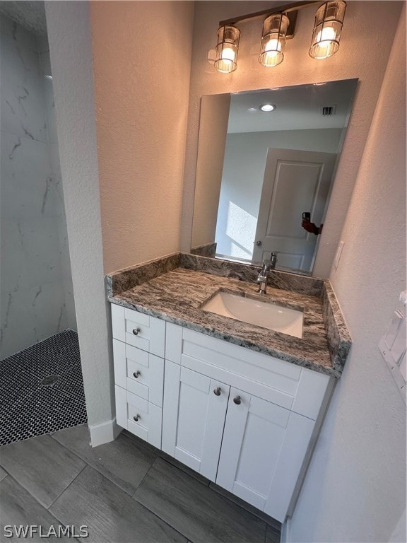 bathroom featuring tile floors and oversized vanity