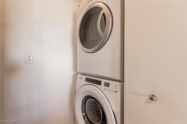 laundry room with stacked washer and dryer