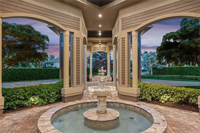 view of patio terrace at dusk