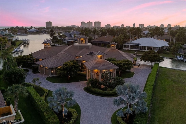 aerial view at dusk with a water view