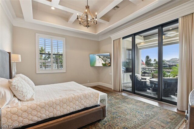 bedroom with coffered ceiling, an inviting chandelier, dark hardwood / wood-style flooring, crown molding, and access to exterior