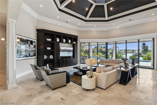 tiled living room with plenty of natural light, crown molding, and decorative columns