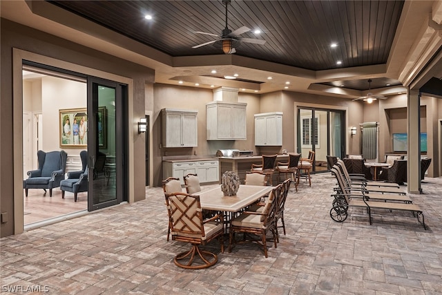 view of patio featuring ceiling fan and exterior kitchen