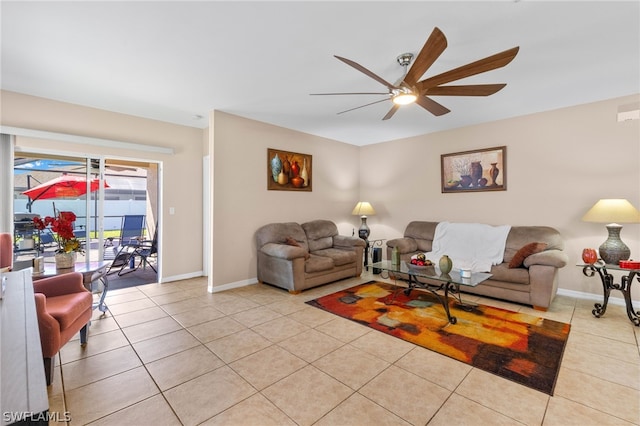 tiled living room with ceiling fan