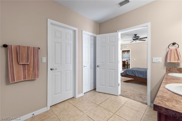 bathroom featuring tile flooring, double vanity, and ceiling fan