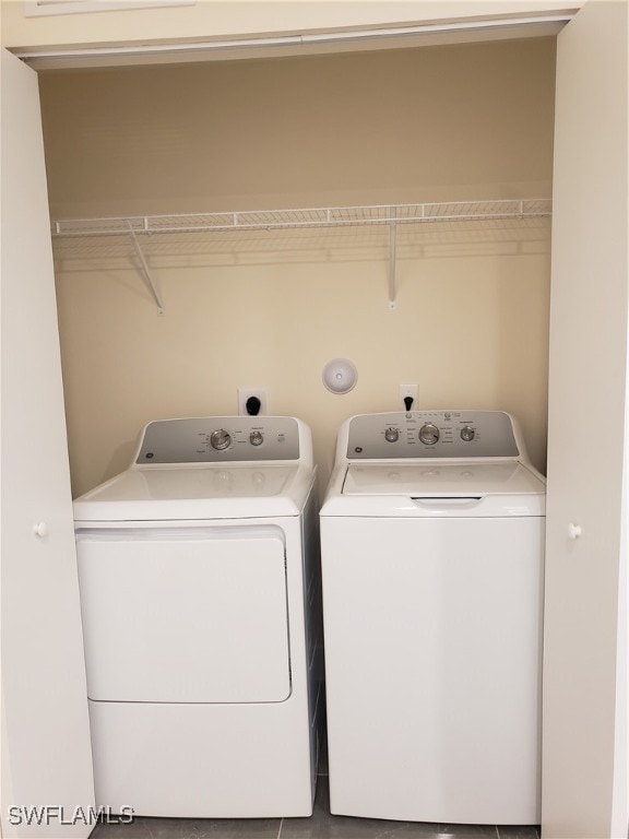 clothes washing area with washer and dryer