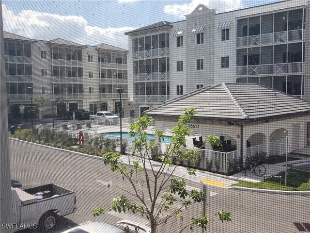 view of property featuring a community pool