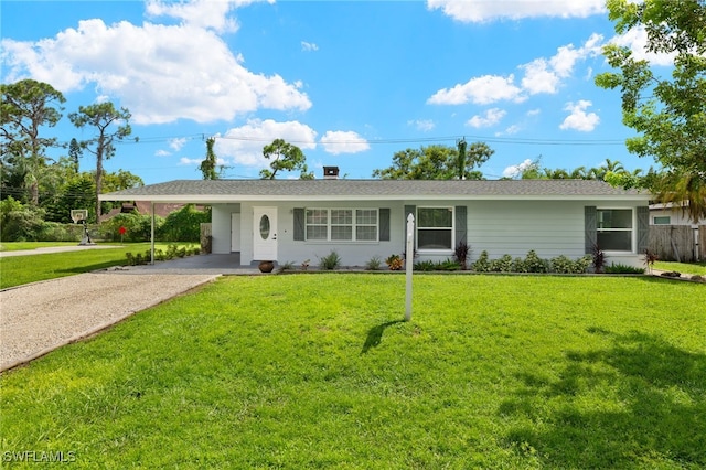 single story home with a front yard and a carport