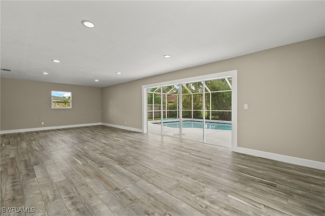 spare room featuring light wood-type flooring