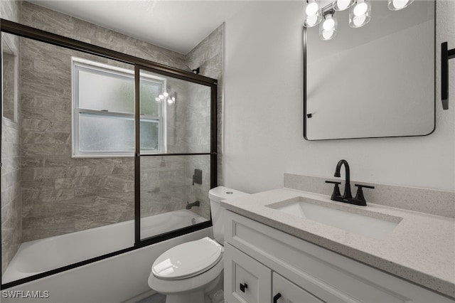 full bathroom with toilet, bath / shower combo with glass door, and vanity