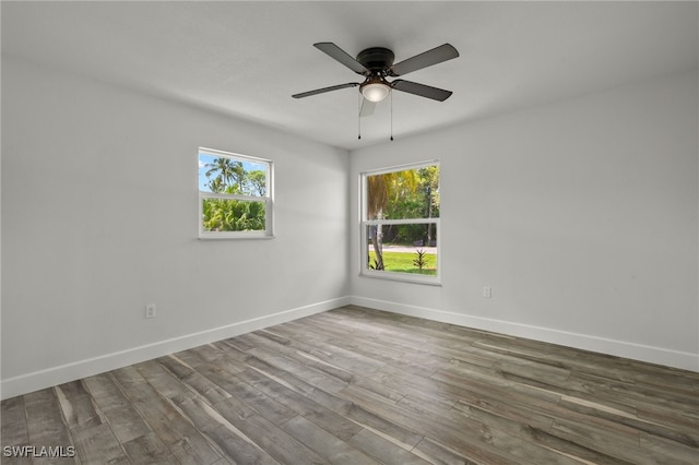 spare room with ceiling fan and hardwood / wood-style flooring