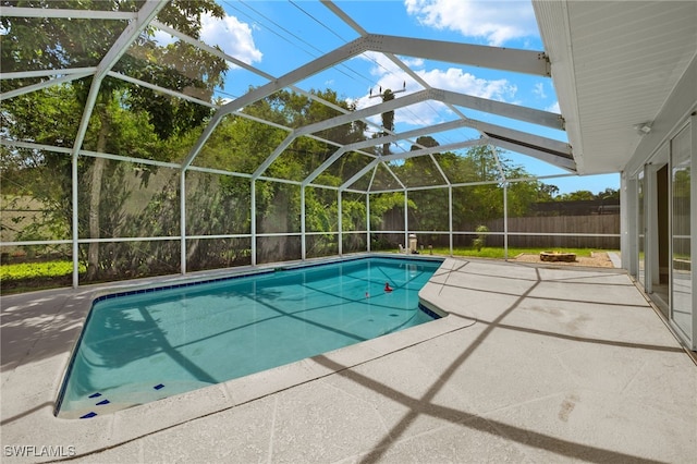 view of pool with a lanai and a patio area