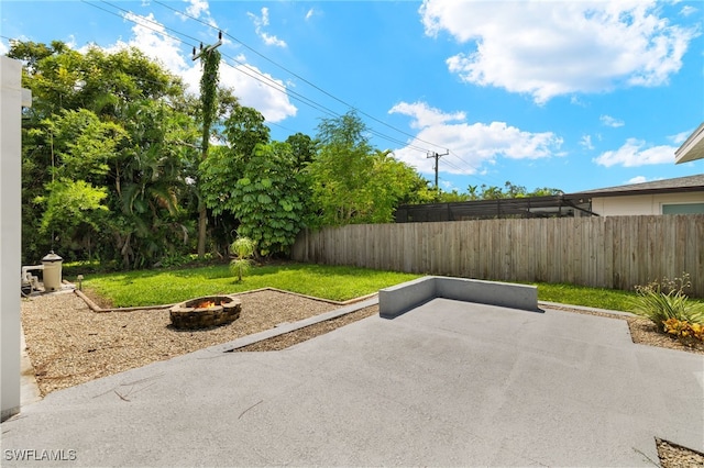 view of patio / terrace featuring an outdoor fire pit