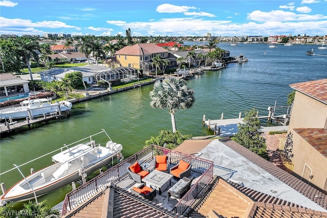 birds eye view of property featuring a water view