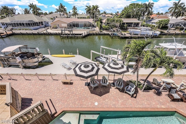 dock area with a water view and a patio