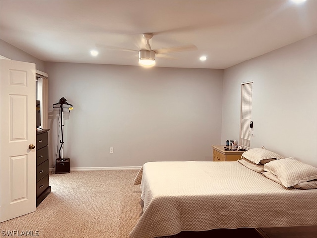 bedroom featuring light colored carpet and ceiling fan