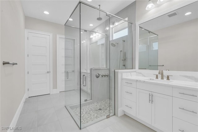 full bathroom featuring recessed lighting, visible vents, vanity, baseboards, and a stall shower