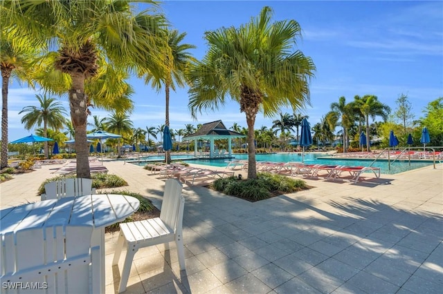 community pool featuring a patio and a gazebo