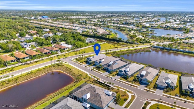 bird's eye view with a water view and a residential view