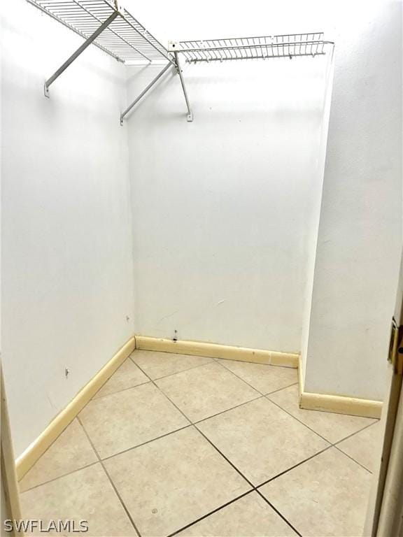 spacious closet featuring tile patterned flooring