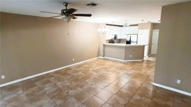 interior space with ceiling fan