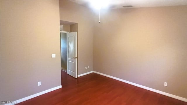 empty room featuring dark hardwood / wood-style floors