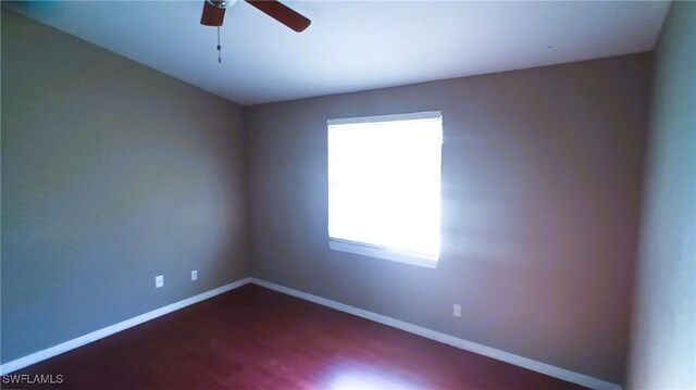 spare room with ceiling fan and a wealth of natural light