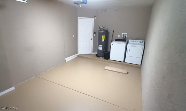 interior space with washing machine and clothes dryer, a garage door opener, and electric water heater