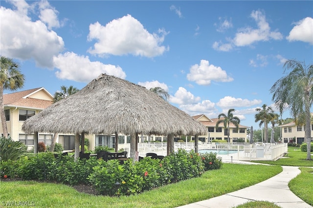 view of home's community with a gazebo, a yard, and a pool