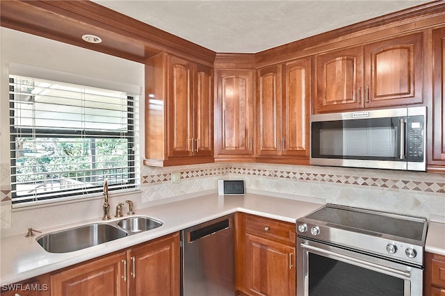 kitchen featuring backsplash, sink, and stainless steel appliances