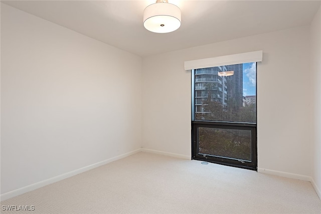 unfurnished room featuring carpet floors