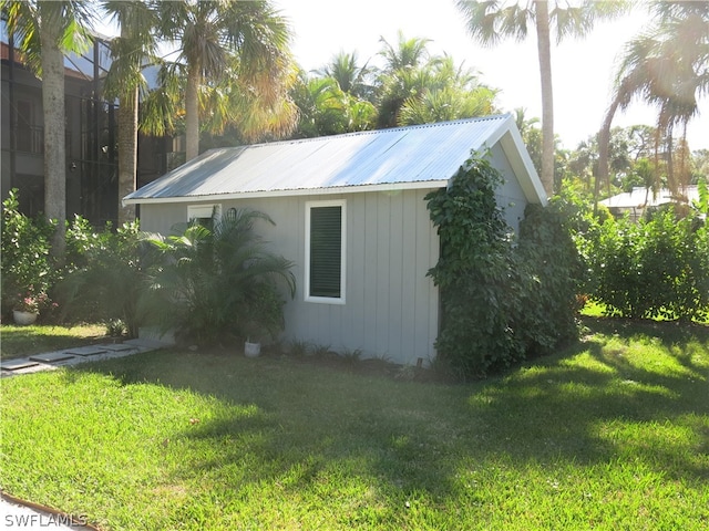 view of side of property with a yard