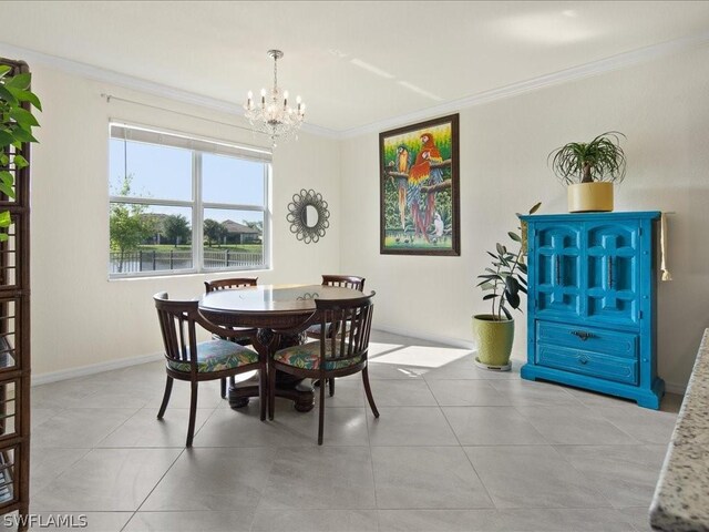 tiled dining room featuring a notable chandelier and ornamental molding