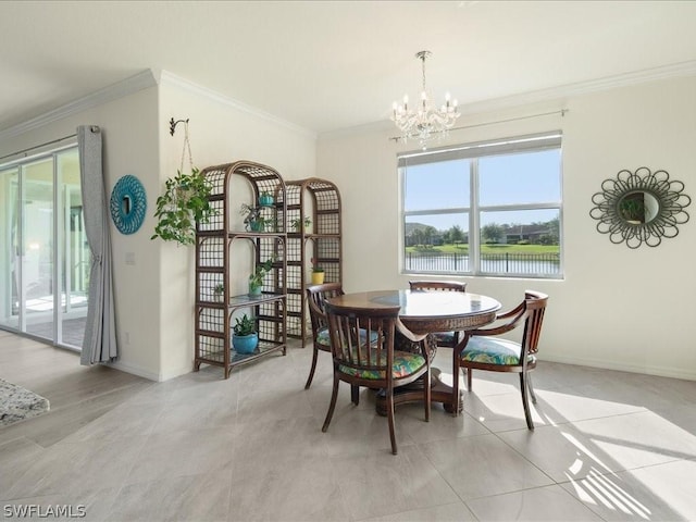 dining space featuring ornamental molding, a notable chandelier, and baseboards